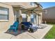 Relaxing patio with seating area, umbrella, and room for grilling at 5707 Butterfield St, Riverview, FL 33578