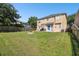 Spacious backyard with firepit and wooden fence at 5707 Butterfield St, Riverview, FL 33578