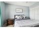 Bedroom with a bed, nightstand, and calming decor at 5707 Butterfield St, Riverview, FL 33578
