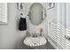 Small bathroom with single sink and oval mirror at 5707 Butterfield St, Riverview, FL 33578