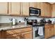 Modern kitchen with stainless steel appliances and granite countertops at 5707 Butterfield St, Riverview, FL 33578