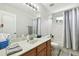Bathroom with tub, toilet and wood vanity at 5707 Butterfield St, Riverview, FL 33578