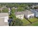 Aerial view of a house's backyard with patio, fire pit, and fenced area at 5707 Butterfield St, Riverview, FL 33578