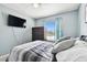 Bedroom with a bed, TV and window view at 5707 Butterfield St, Riverview, FL 33578