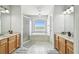 Elegant bathroom with a large soaking tub and double vanity at 5707 Butterfield St, Riverview, FL 33578