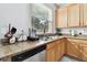 Kitchen with stainless steel dishwasher and granite countertop at 5707 Butterfield St, Riverview, FL 33578