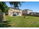 Spacious backyard with firepit and plenty of green space at 5707 Butterfield St, Riverview, FL 33578