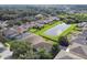 Aerial perspective of houses near a pond in a residential area at 5707 Butterfield St, Riverview, FL 33578