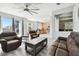Living room with leather furniture and views into the kitchen at 5707 Butterfield St, Riverview, FL 33578