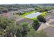 Aerial view of a house and surrounding neighborhood with a lake at 5707 Butterfield St, Riverview, FL 33578