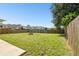 Large backyard with firepit and wooden fence at 5707 Butterfield St, Riverview, FL 33578
