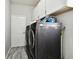 Bright laundry room with washer, dryer, and ample cabinet space at 5707 Butterfield St, Riverview, FL 33578