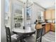 Kitchen breakfast nook with round table and four chairs at 5707 Butterfield St, Riverview, FL 33578