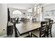 Open concept dining room with a long table and chairs, offering views of the entryway at 5707 Butterfield St, Riverview, FL 33578