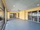 Large screened patio with sliding glass doors and a ceiling fan at 7702 Ivory Ter, New Port Richey, FL 34655