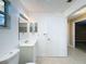 Simple bathroom with toilet, vanity, and mirror at 7702 Ivory Ter, New Port Richey, FL 34655