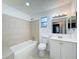 Clean bathroom with a bathtub, toilet, and vanity at 7702 Ivory Ter, New Port Richey, FL 34655
