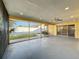 Expansive screened patio offering backyard views and a ceiling fan at 7702 Ivory Ter, New Port Richey, FL 34655