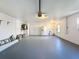 Spacious garage, offering extra storage space and extra-wide entry at 7702 Ivory Ter, New Port Richey, FL 34655