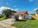 Single Gathering home with a two car garage and a driveway at 7702 Ivory Ter, New Port Richey, FL 34655