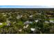 An aerial shot showcasing a house and surrounding neighborhood, highlighting its peaceful setting at 1810 S Valrico Rd, Valrico, FL 33596
