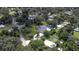 Aerial view showing home, pool, and expansive lot with lush landscaping at 1810 S Valrico Rd, Valrico, FL 33596