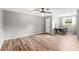 Spacious bedroom with wood-look floors and ceiling fan at 1810 S Valrico Rd, Valrico, FL 33596