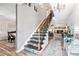 Grand staircase with an ornate chandelier at 1810 S Valrico Rd, Valrico, FL 33596