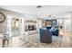 Cozy living room with a fireplace and access to a patio at 1810 S Valrico Rd, Valrico, FL 33596