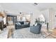 Spacious living room featuring a comfy couch and a fireplace at 1810 S Valrico Rd, Valrico, FL 33596