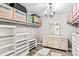 Spacious walk-in closet with ample shelving and drawers at 1810 S Valrico Rd, Valrico, FL 33596
