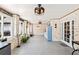Covered patio with pool access and ceiling fans at 1810 S Valrico Rd, Valrico, FL 33596