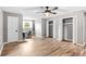 Bright bedroom featuring wood flooring, a closet, and a workspace at 1810 S Valrico Rd, Valrico, FL 33596