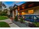 Well-lit front porch with blue railings and welcoming details at 1810 S Valrico Rd, Valrico, FL 33596