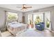 Bright bedroom with a comfortable bed and large windows at 1810 S Valrico Rd, Valrico, FL 33596