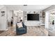 Open living room with built-in entertainment center and comfy seating at 1810 S Valrico Rd, Valrico, FL 33596