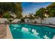 Relaxing pool area with spacious patio and surrounding greenery at 1810 S Valrico Rd, Valrico, FL 33596