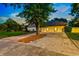 Spacious driveway leading to a three-car garage at 1810 S Valrico Rd, Valrico, FL 33596
