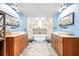 Double vanity bathroom with a freestanding tub and a walk in shower at 1810 S Valrico Rd, Valrico, FL 33596