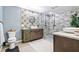 Modern bathroom with a walk-in shower and patterned tile at 1810 S Valrico Rd, Valrico, FL 33596