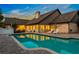 Stunning pool reflecting the home's lights at 1810 S Valrico Rd, Valrico, FL 33596