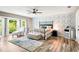 Main bedroom with a king-size bed and floral wallcovering at 1810 S Valrico Rd, Valrico, FL 33596