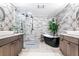 Large bathroom with double vanity, soaking tub, and walk-in shower at 1810 S Valrico Rd, Valrico, FL 33596