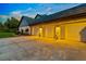 Three-car garage with stylish lighting at 1810 S Valrico Rd, Valrico, FL 33596