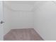 Spacious walk-in closet with wire shelving at 10813 Rolling Moss Rd, Tampa, FL 33647