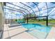 Enclosed pool and spa with lake view at 10813 Rolling Moss Rd, Tampa, FL 33647
