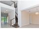 Two-story entryway with a staircase and an open concept at 10813 Rolling Moss Rd, Tampa, FL 33647