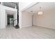Bright dining room with wood-look floors and an open floor plan at 10813 Rolling Moss Rd, Tampa, FL 33647