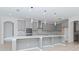 Modern kitchen with gray cabinets and quartz countertops at 10813 Rolling Moss Rd, Tampa, FL 33647