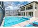 Enclosed pool and spa with lake view at 10813 Rolling Moss Rd, Tampa, FL 33647
